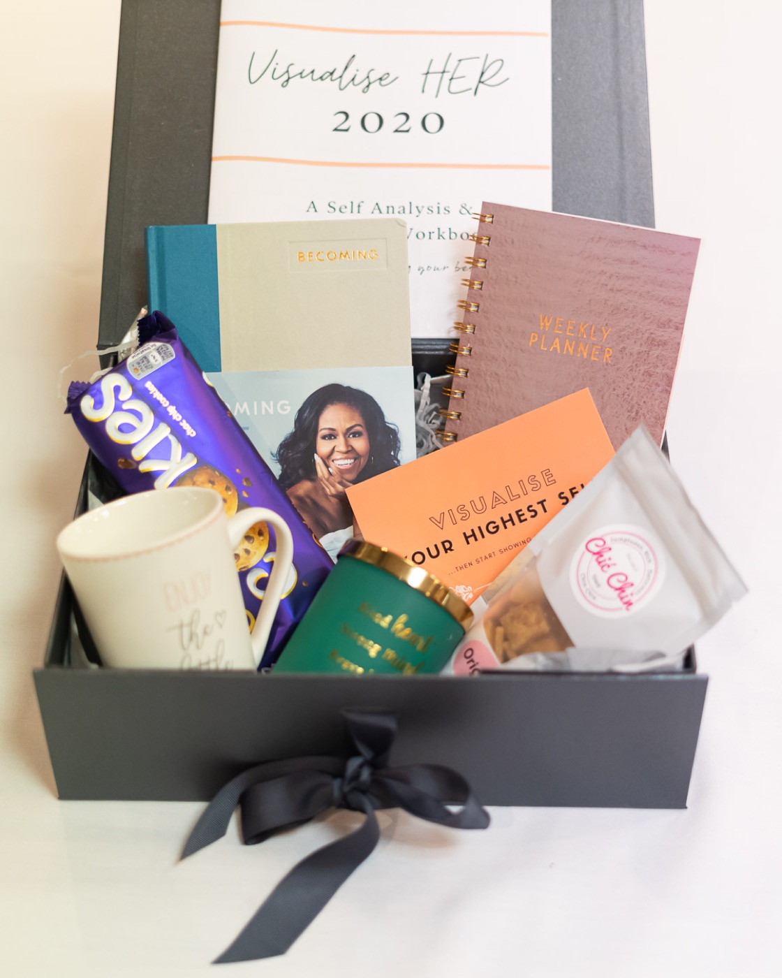 A Visualise HER 2020 gift box with journals and treats