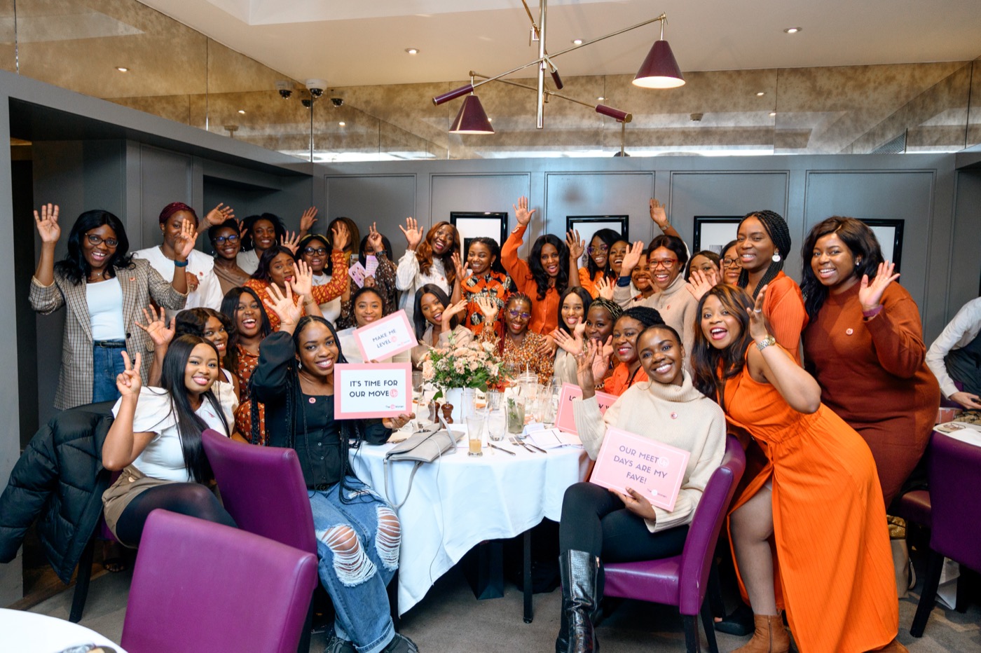 A room full of people celebrating together at a past gathering