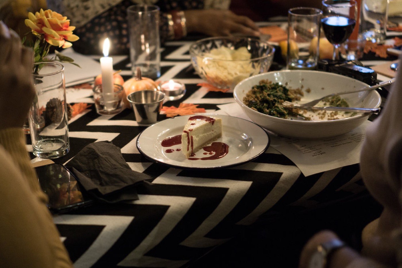 A dessert plate and candlelight on a styled dinner table